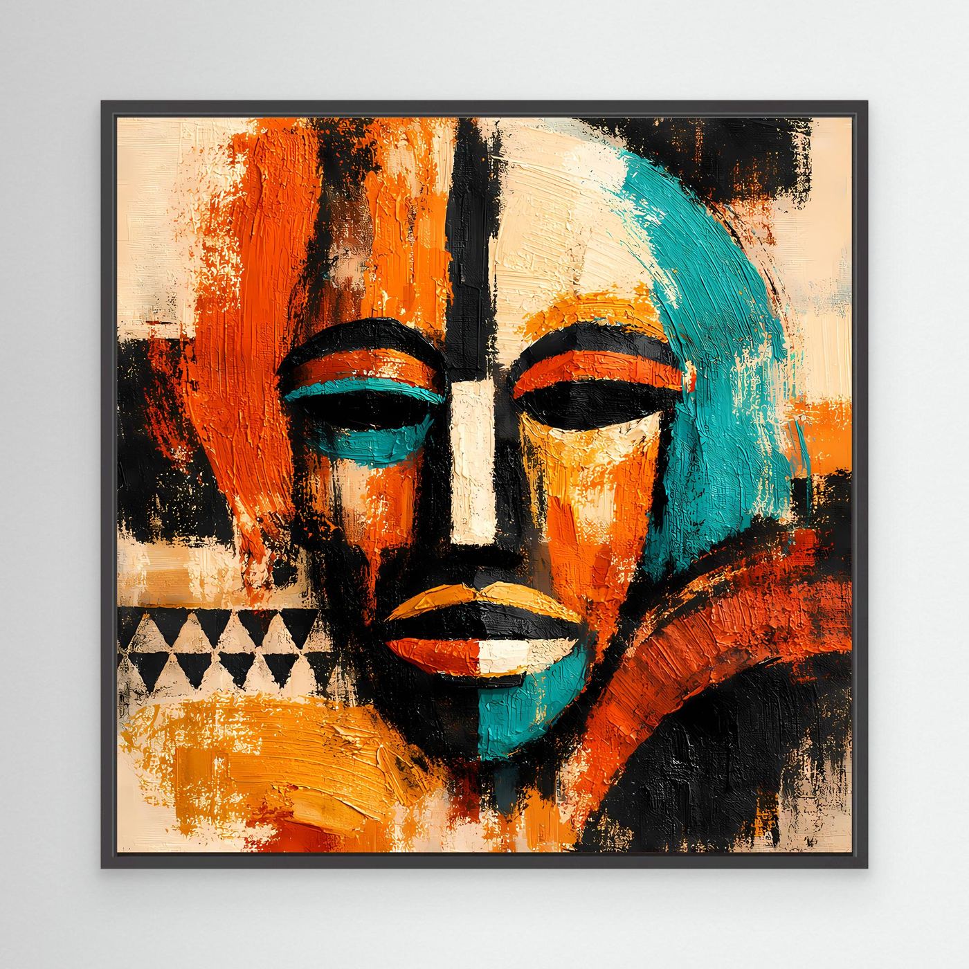 Abstract mask portrait canvas with teal and orange faces and black accents, black frame