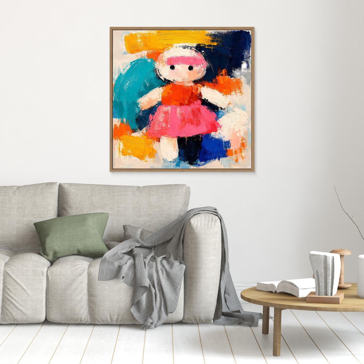 Abstract doll canvas wall art with pink hat and bright orange dress, light wood frame
