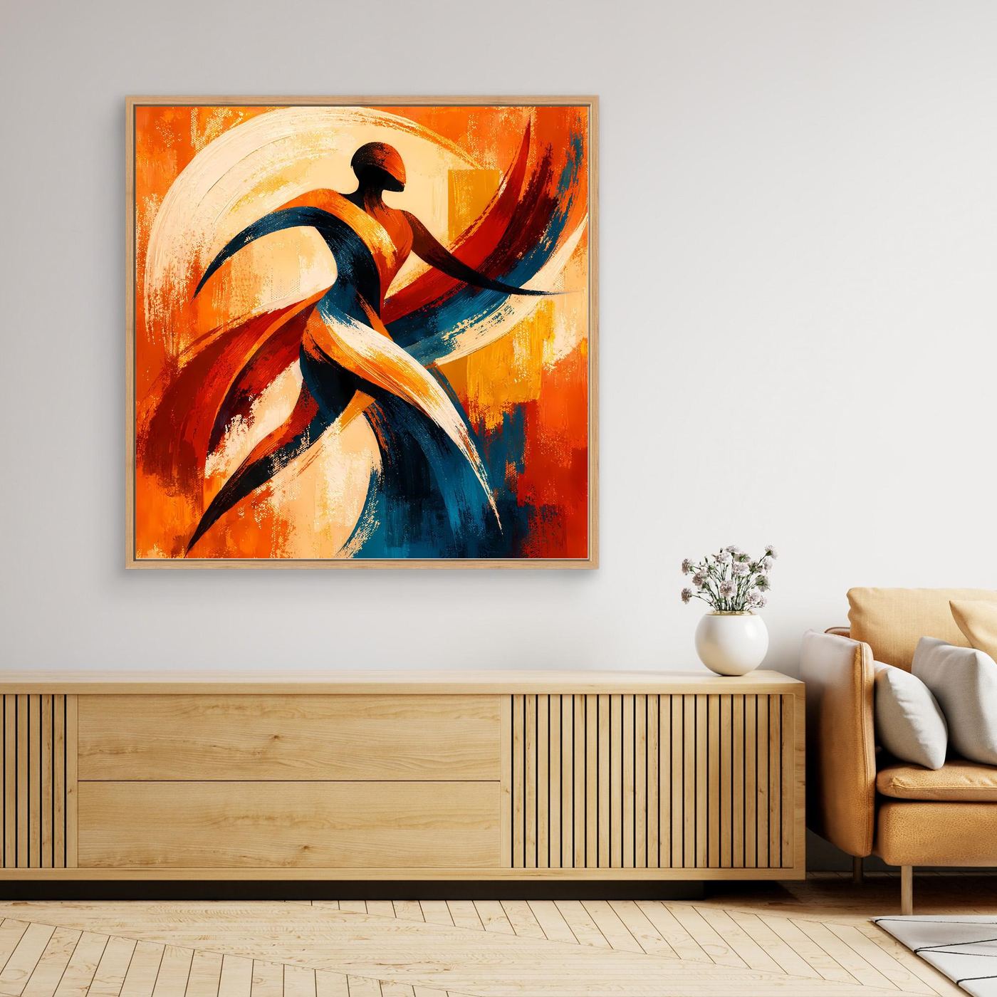 Leinwandbild mit abstrakter Tänzer-Silhouette in Orange, Blau und Rot, goldfarben gerahmt.