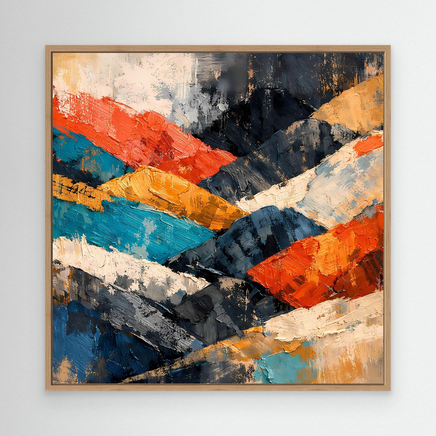 Abstraktes Berglandschaft-Wandbild mit hellem Holzrahmen; farbige Gebirgsstruktur in Blau, Orange, Weiß.