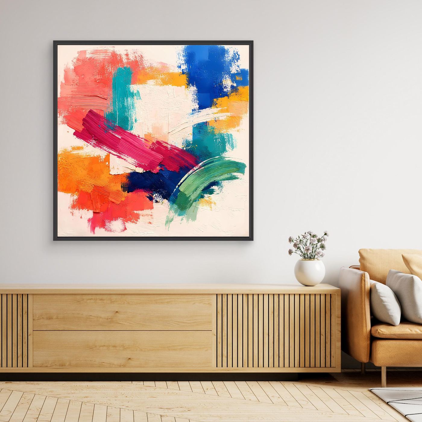 Colorful abstract canvas painting in a black frame with bold brush strokes: red, blue, teal, yellow.