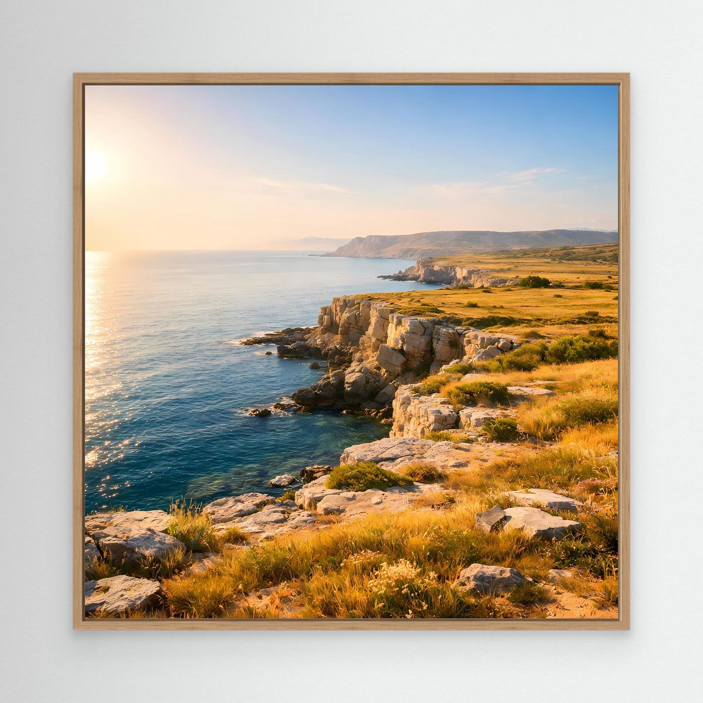 Leinwandbild Steilküste mit Meer und Felsen bei Sonnenuntergang, Eichenrahmen