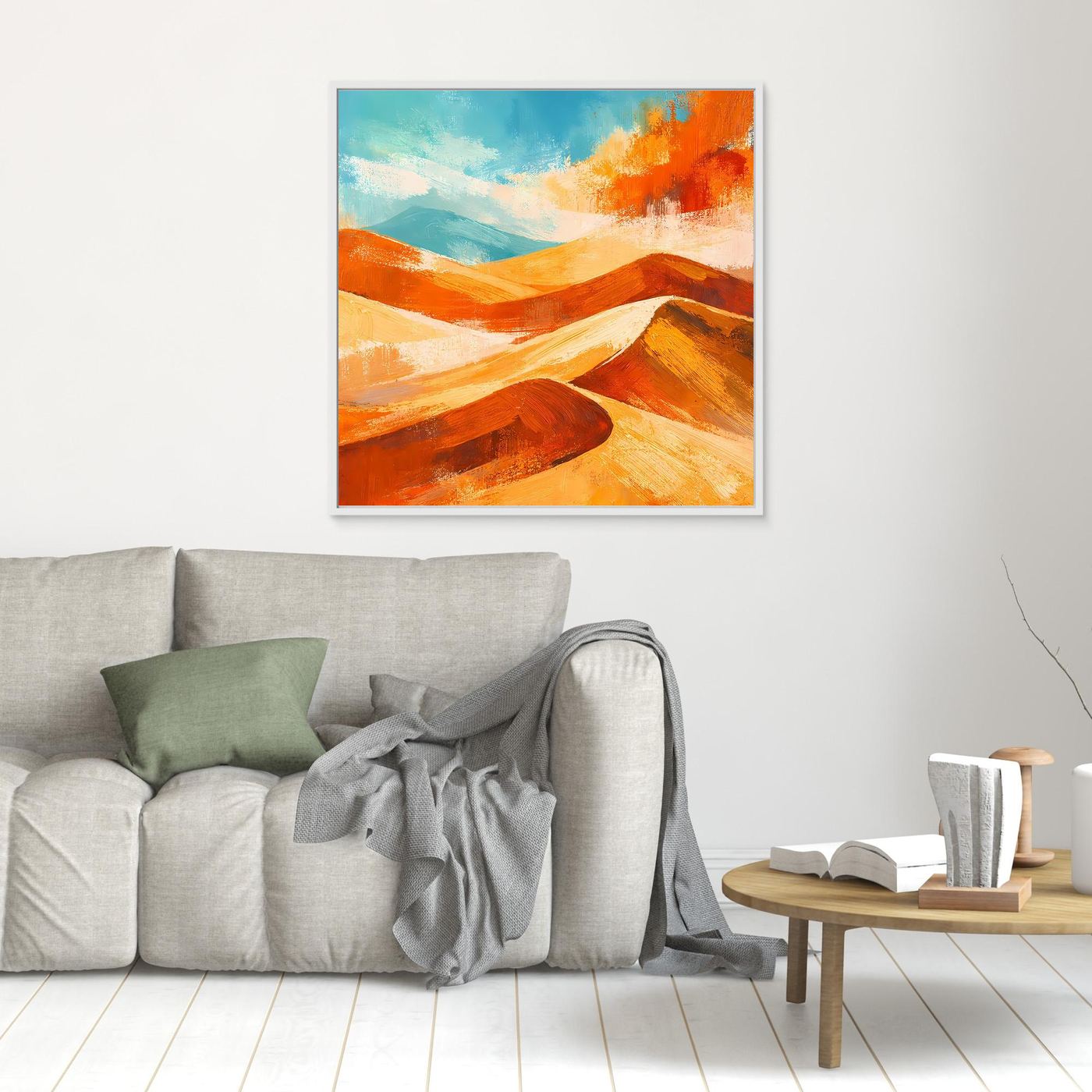 Abstract desert wall art with orange and gold dunes and blue sky; white frame