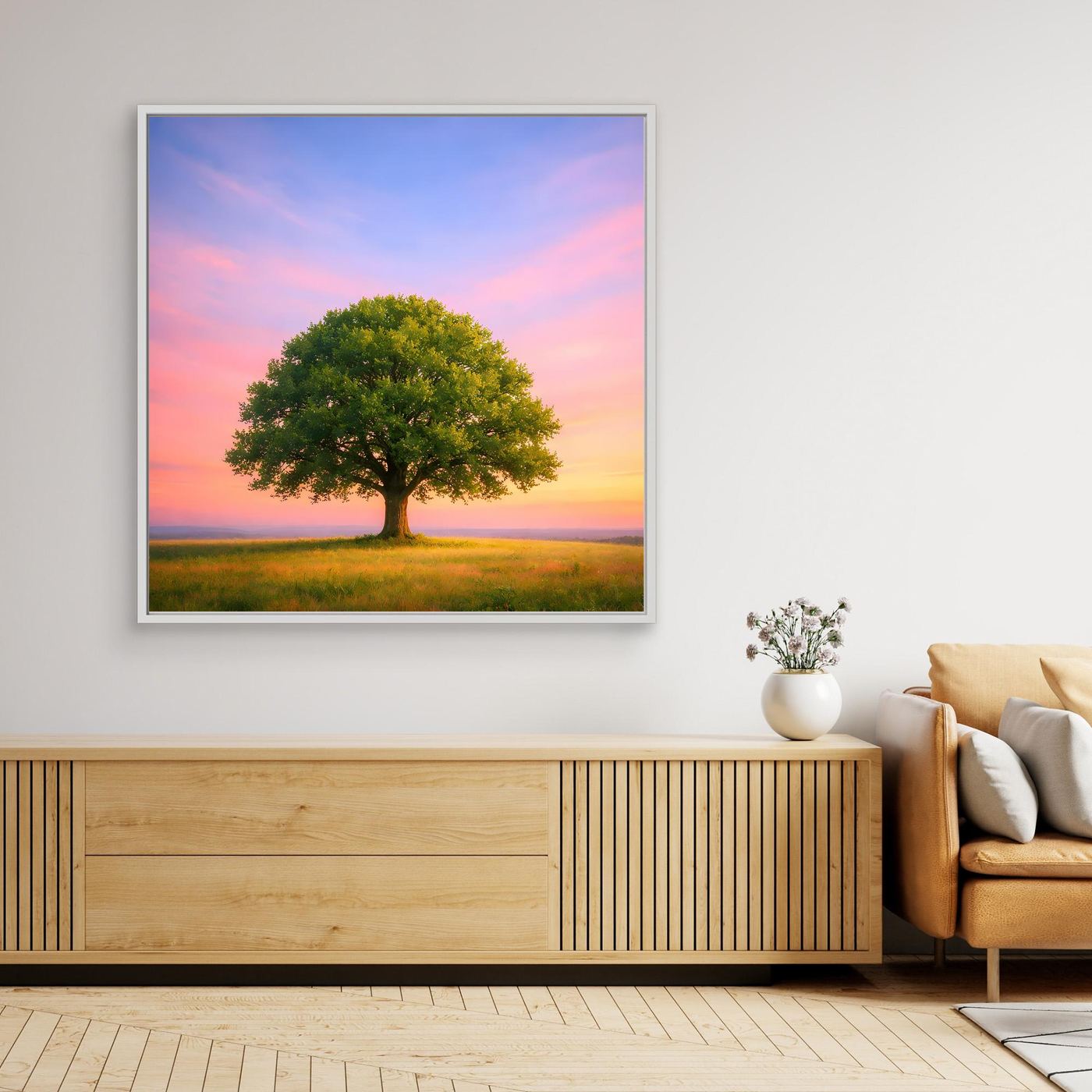 Leinwandbild: Solitärbaum auf Wiese mit Sonnenuntergang am rosa Himmel, weißer Rahmen