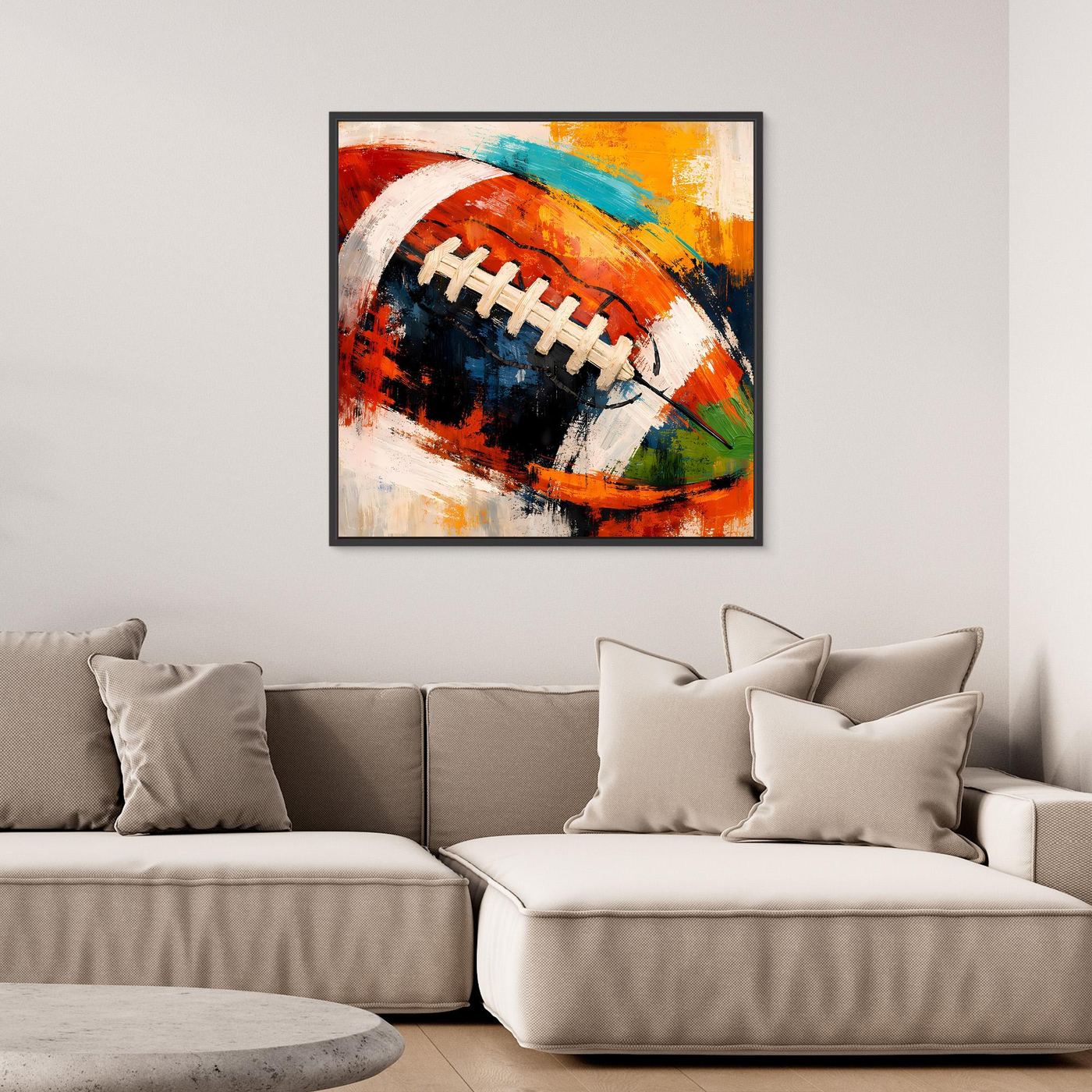 Leinwandbild mit abstraktem American-Football in Rot, Blau, Gelb im schwarzen Rahmen
