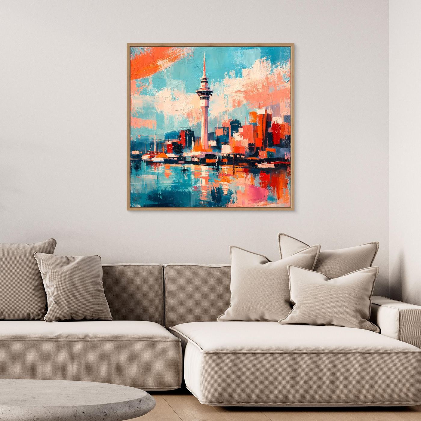 Wandbild mit abstrakter Skyline und Sky Tower in türkis-orange, im hellen Rahmen