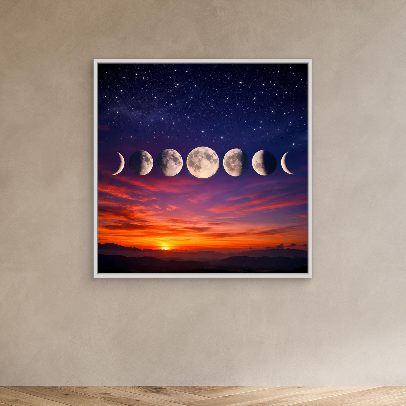 Leinwandbild mit Sternenhimmel und Mondphasen in weißem Rahmen an der Wand
