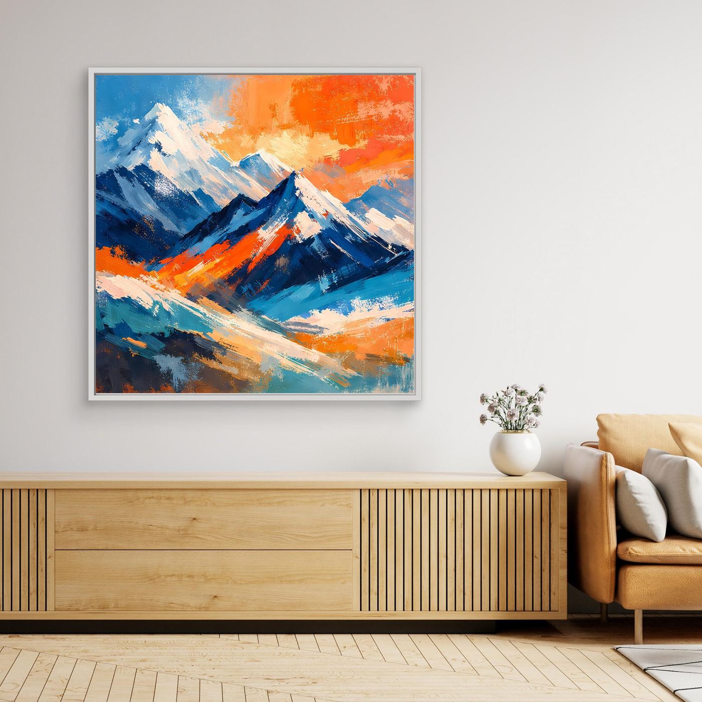 Wandbild mit abstrakter Berglandschaft, kräftige Blau- und Orangetöne, weißer Rahmen