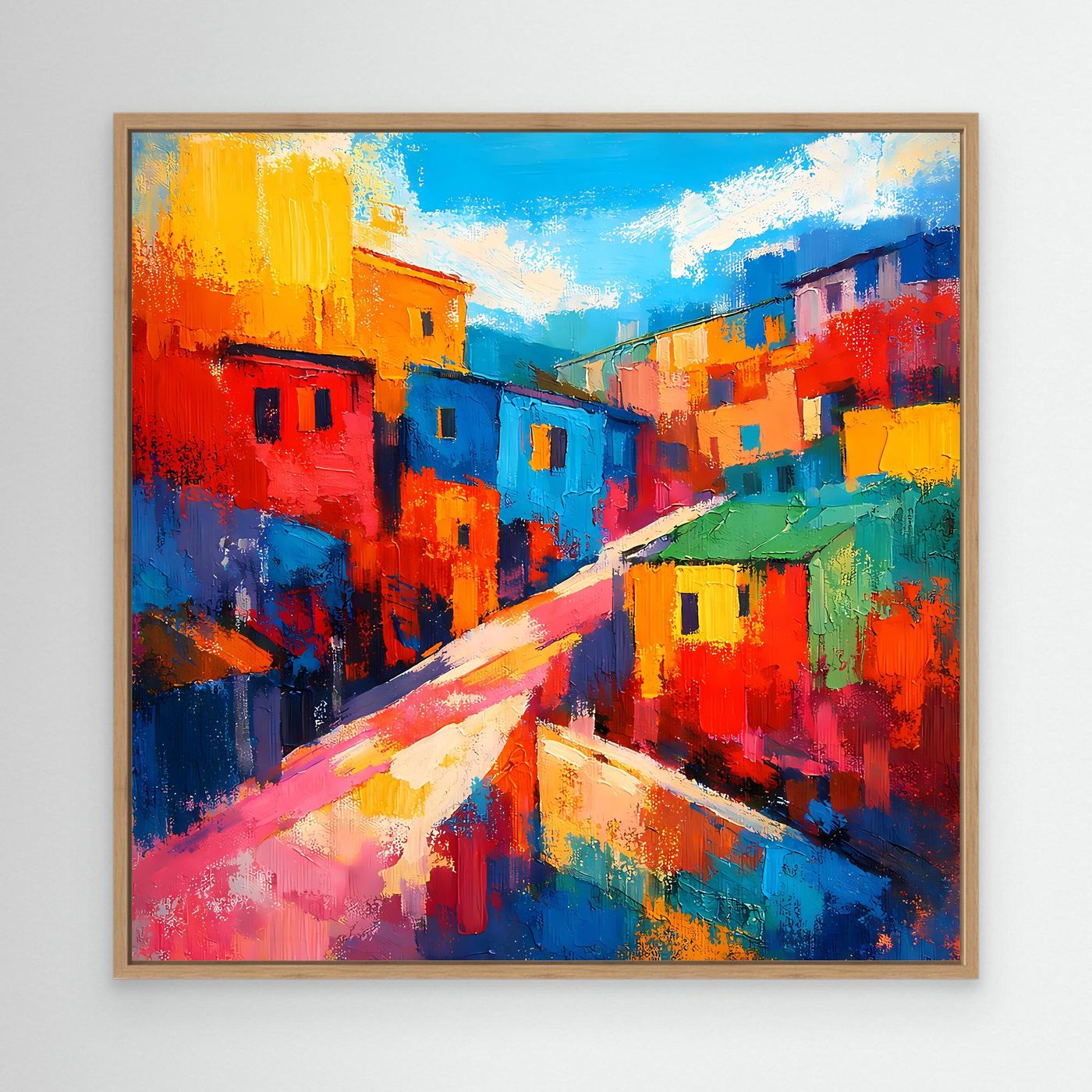 Abstraktes Favela-Wandbild auf Leinwand mit hellem Holzrahmen: farbige Häuserstraße