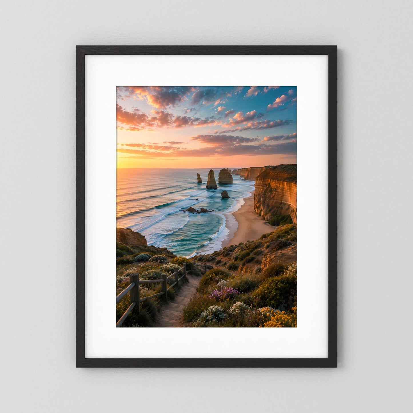 Hochkant-Poster mit Küstenlandschaft bei Sonnenuntergang, schwarzer Rahmen und weißes Passepartout