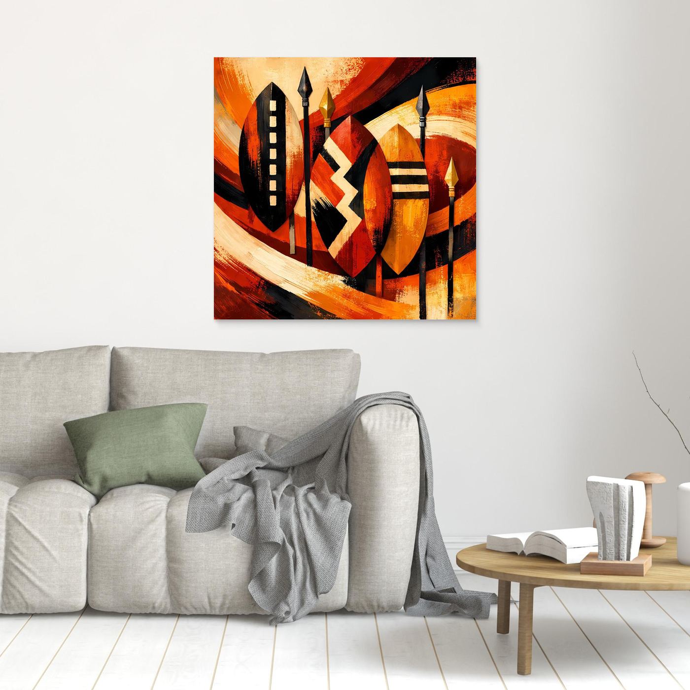 Quadratisches Leinwandbild mit afrikanischen Schild- und Speermotiven, schwarzer Rahmen, warmes Orange