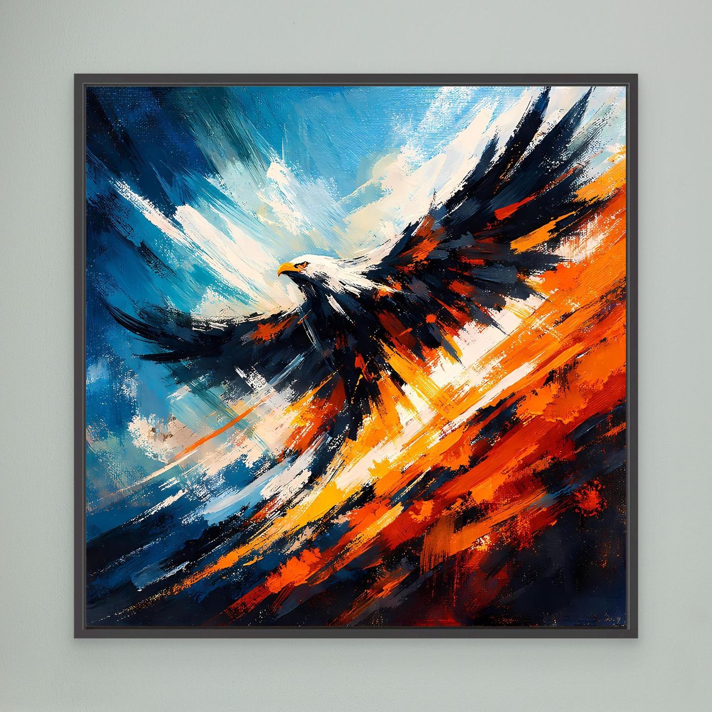Wandbild mit abstraktem Adler in Blau, Orange und Schwarz, schwarz gerahmt