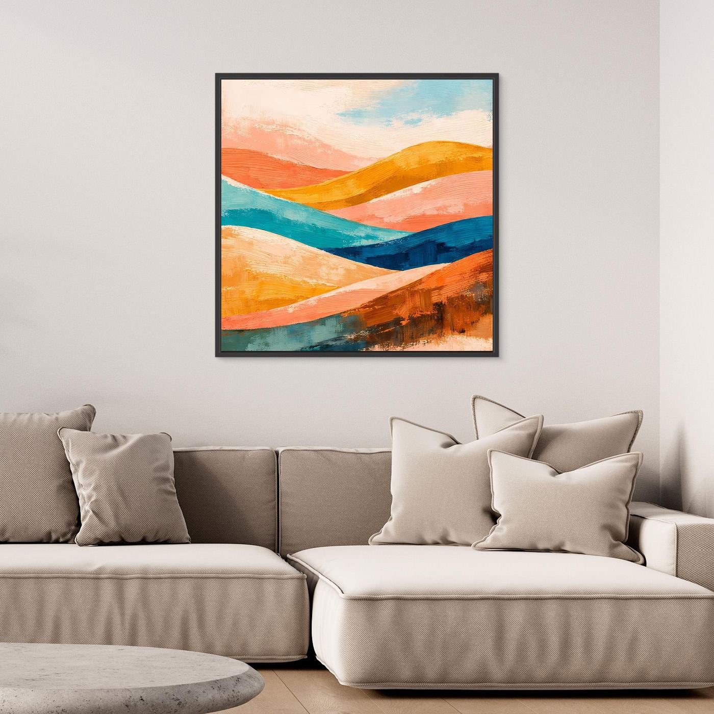 Black-framed canvas wall art with abstract orange, teal, and blue rolling hills