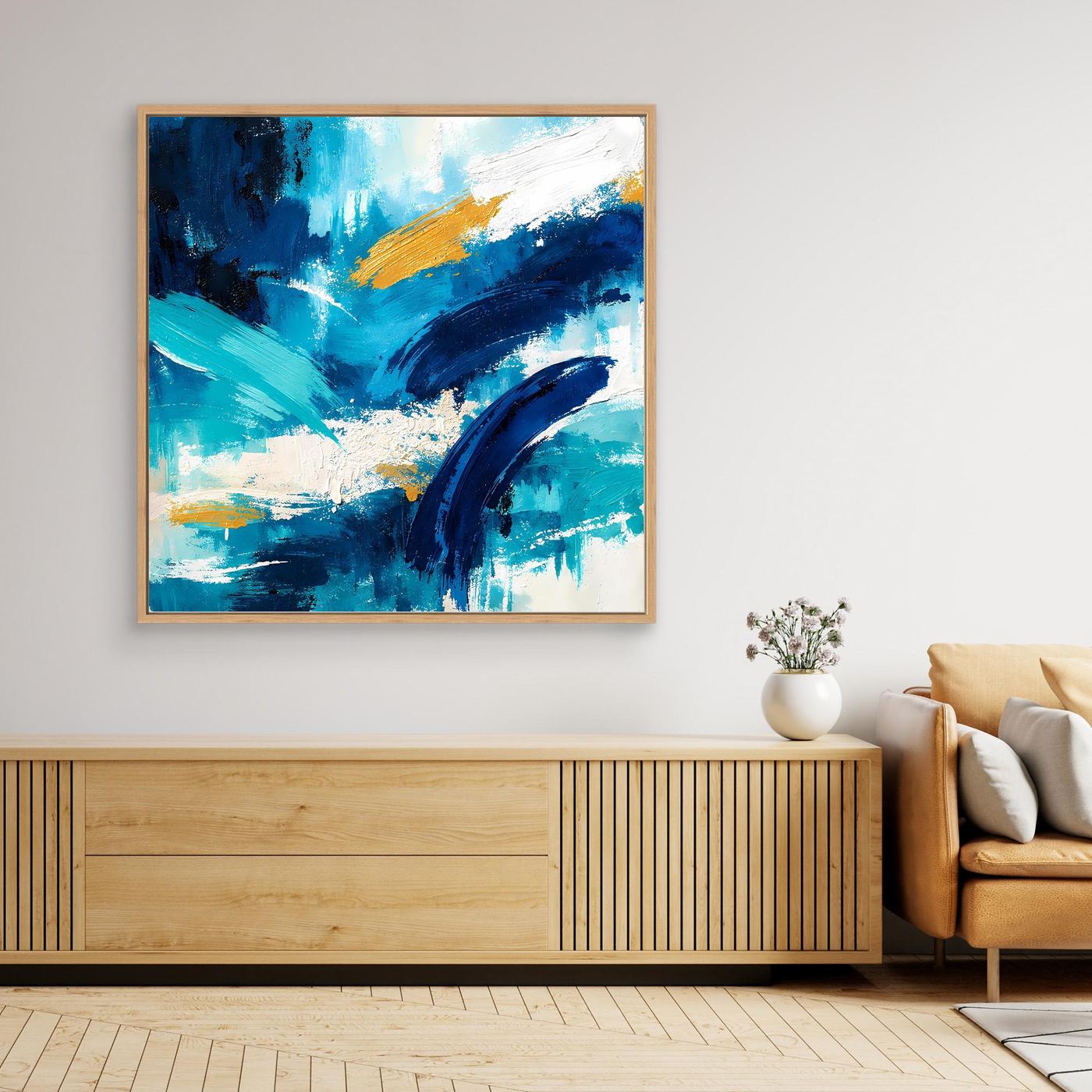 Framed abstract blue and gold canvas wall art with teal, navy, and gold paint strokes, square