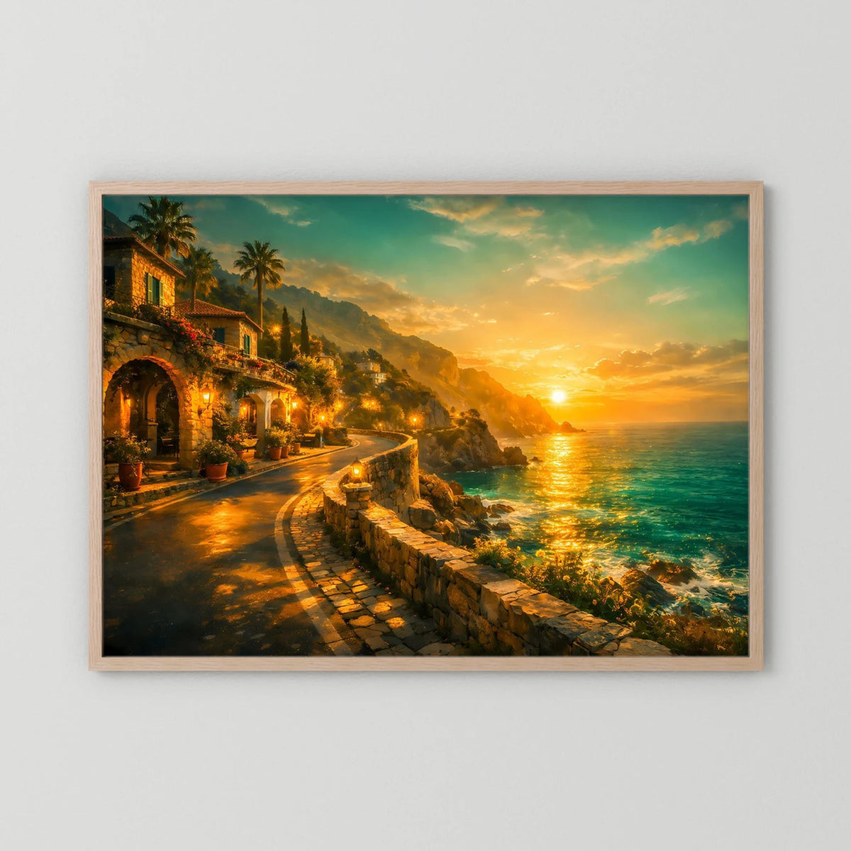 Wandbild mit hellem Holzrahmen und Küstenlandschaft bei Sonnenuntergang