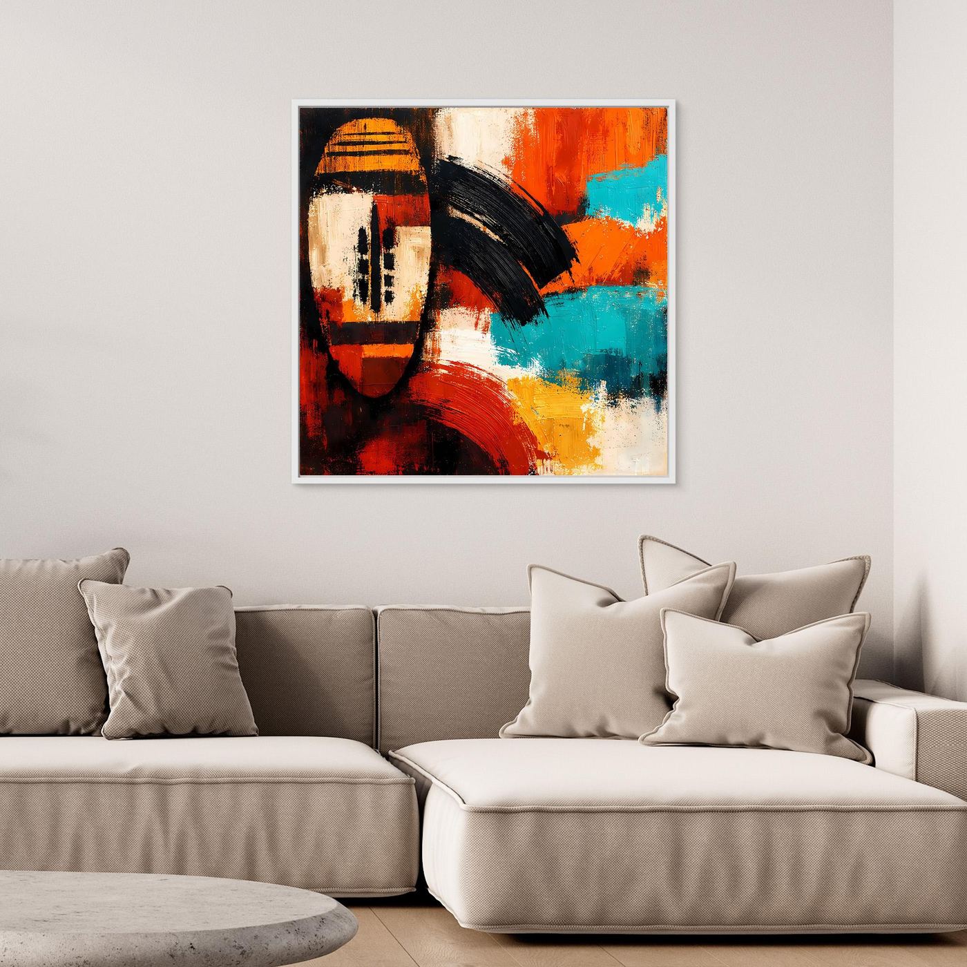 Framed abstract mask wall art with bold orange, turquoise, black, and cream color blocks