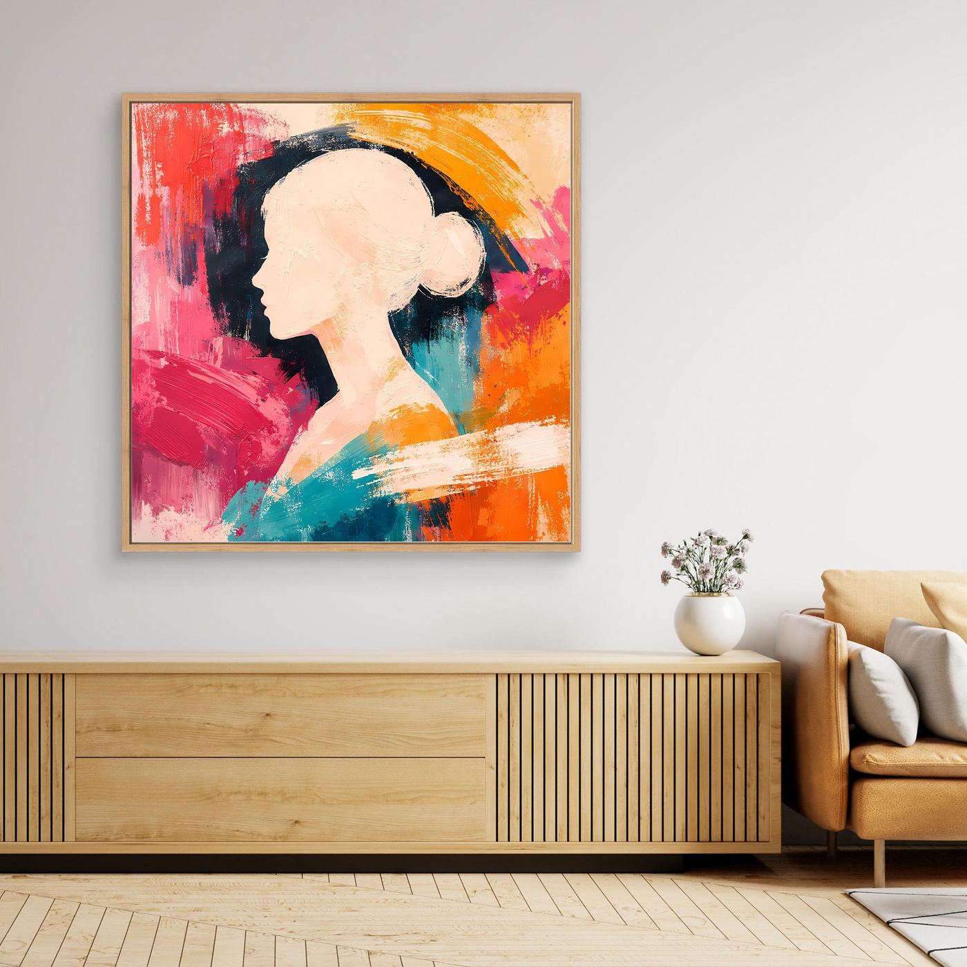 Abstract canvas wall art with woman silhouette in red, teal, and orange, with wooden frame.