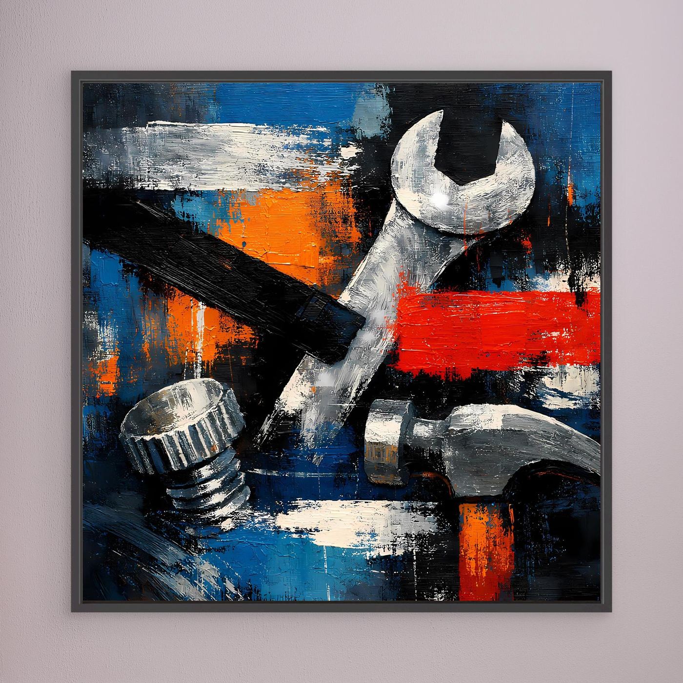 Framed abstract tool wall art with wrench and tools in blue, orange and red, black frame.