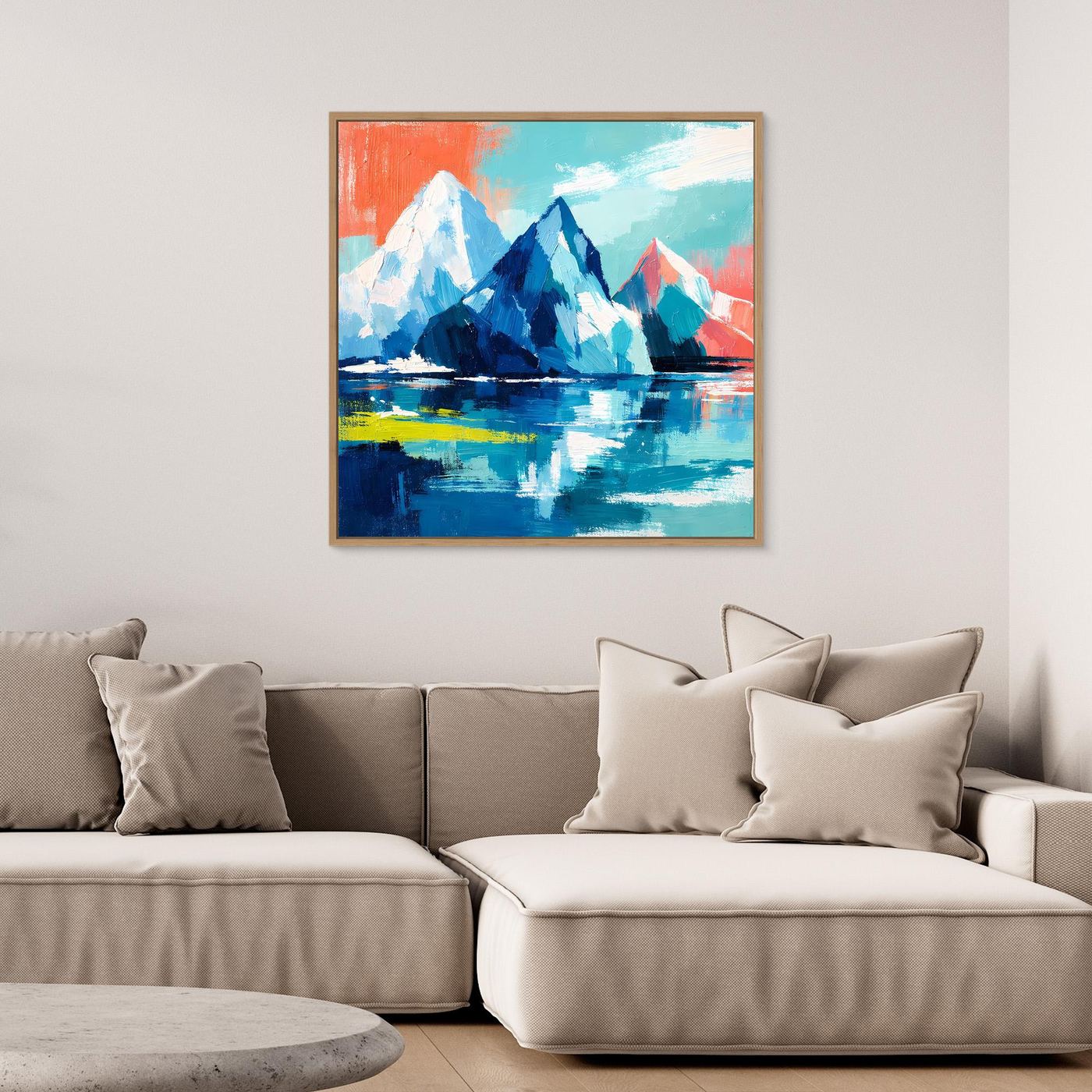 Abstract mountain and sea wall art with blue icebergs and teal sky, in a gold frame