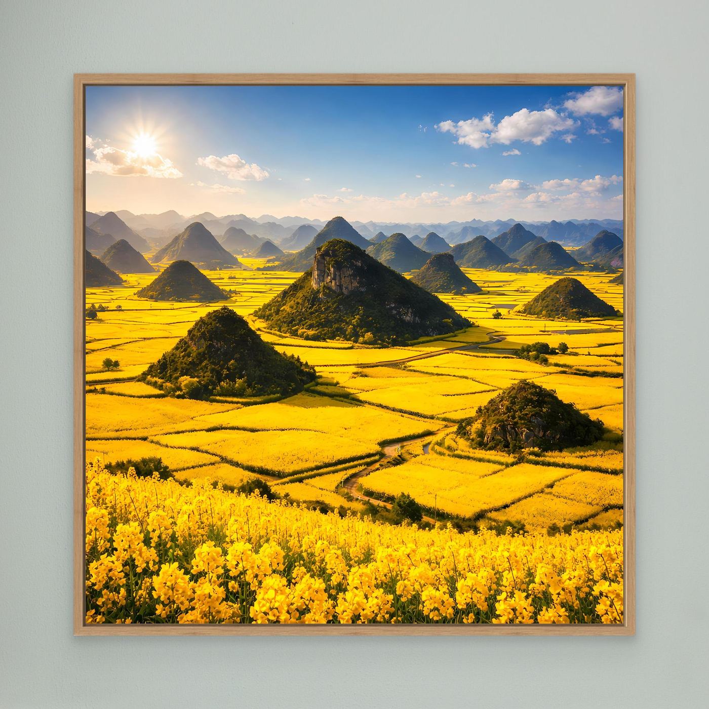 Leinwandbild mit goldenem Rapsfeld und Karstbergen, Holzrahmen (Eiche)