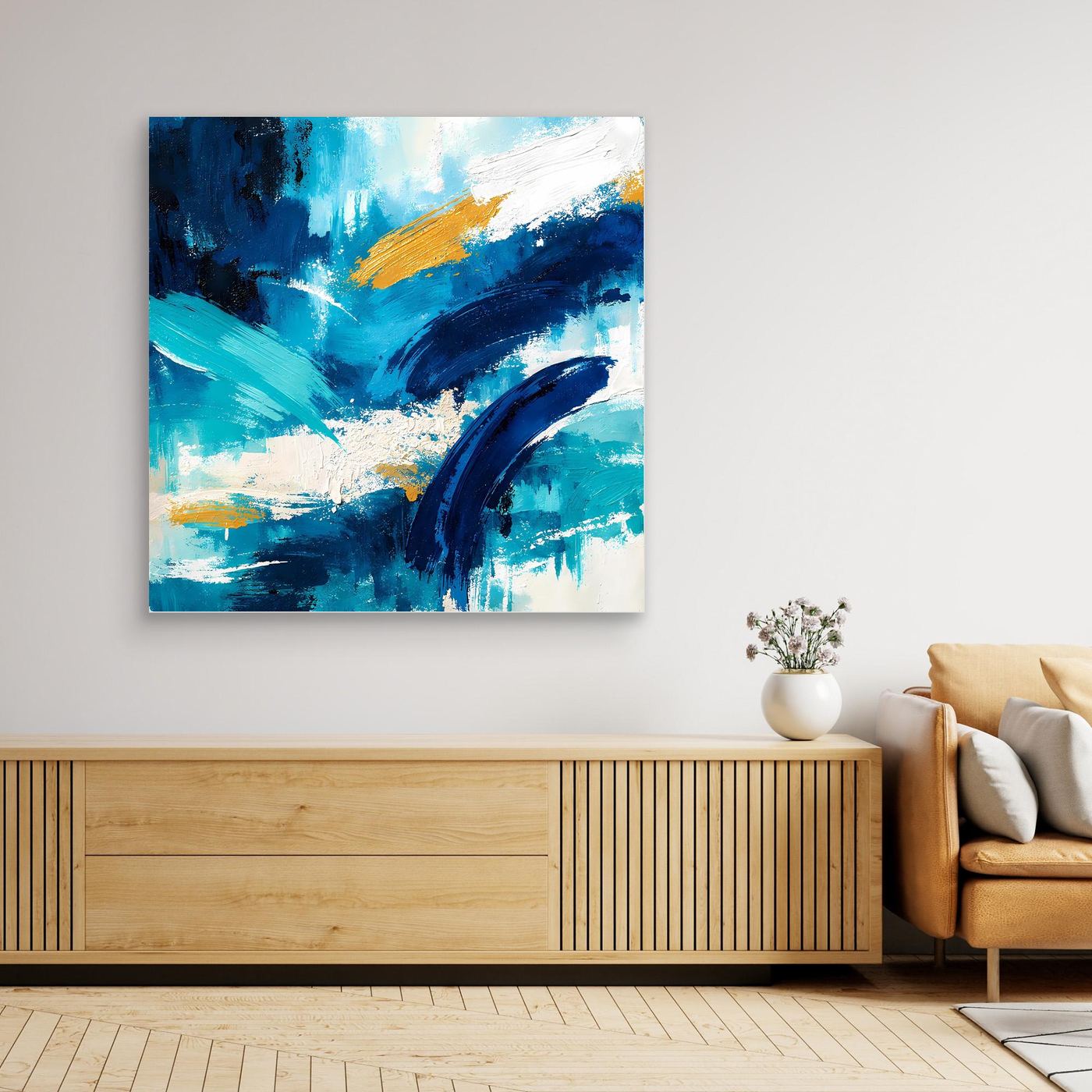 Abstract blue and gold canvas wall art with diagonal strokes and splatter, square on wall