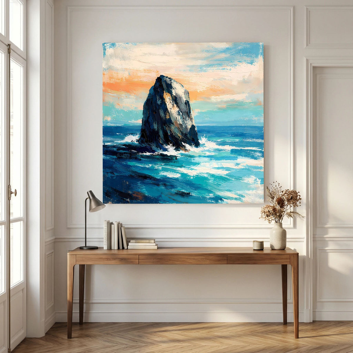 Quadratisches Leinwandbild mit Felsen in der Brandung, blaues Meer und orangefarbene Abendfarben.