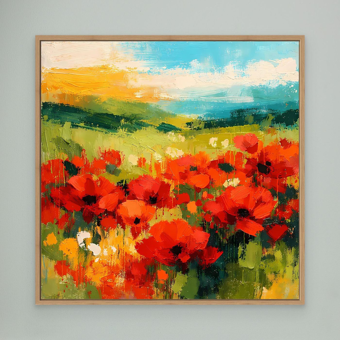 Abstract canvas wall art of a bright red poppy field with green and blue horizon, oak frame