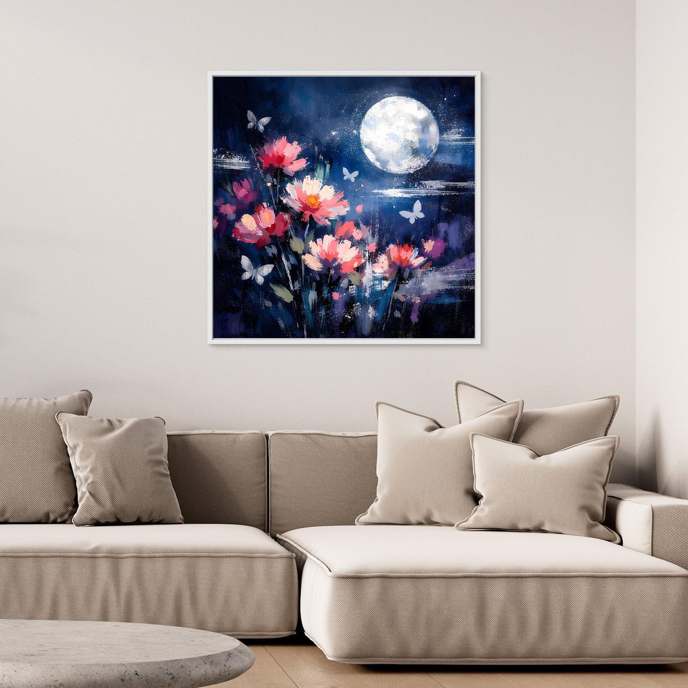 Gerahmtes Wandbild mit blühenden Blumen, Schmetterlingen und hellem Vollmond; weißer Rahmen.