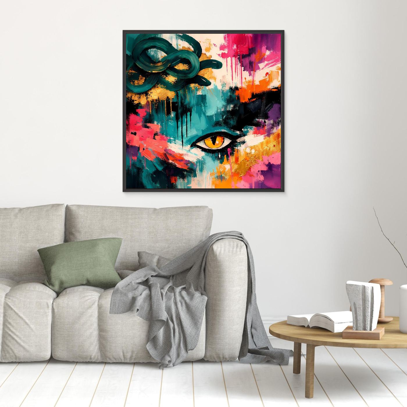 Abstraktes, quadratisches Wandbild mit Medusa-Auge in Türkis, Rot und Gelb, schwarz gerahmt