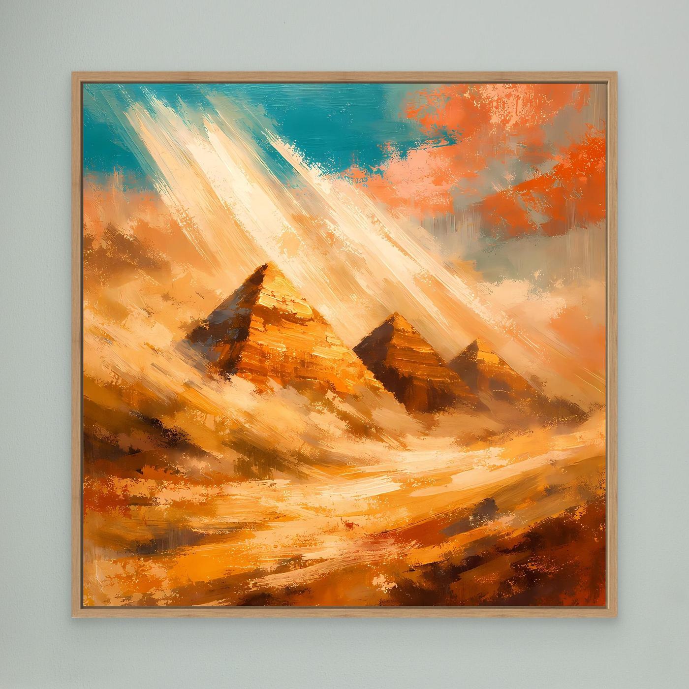Abstraktes Leinwand-Wandbild mit Pyramiden und Sonnenstrahlen, im hellen Holzrahmen