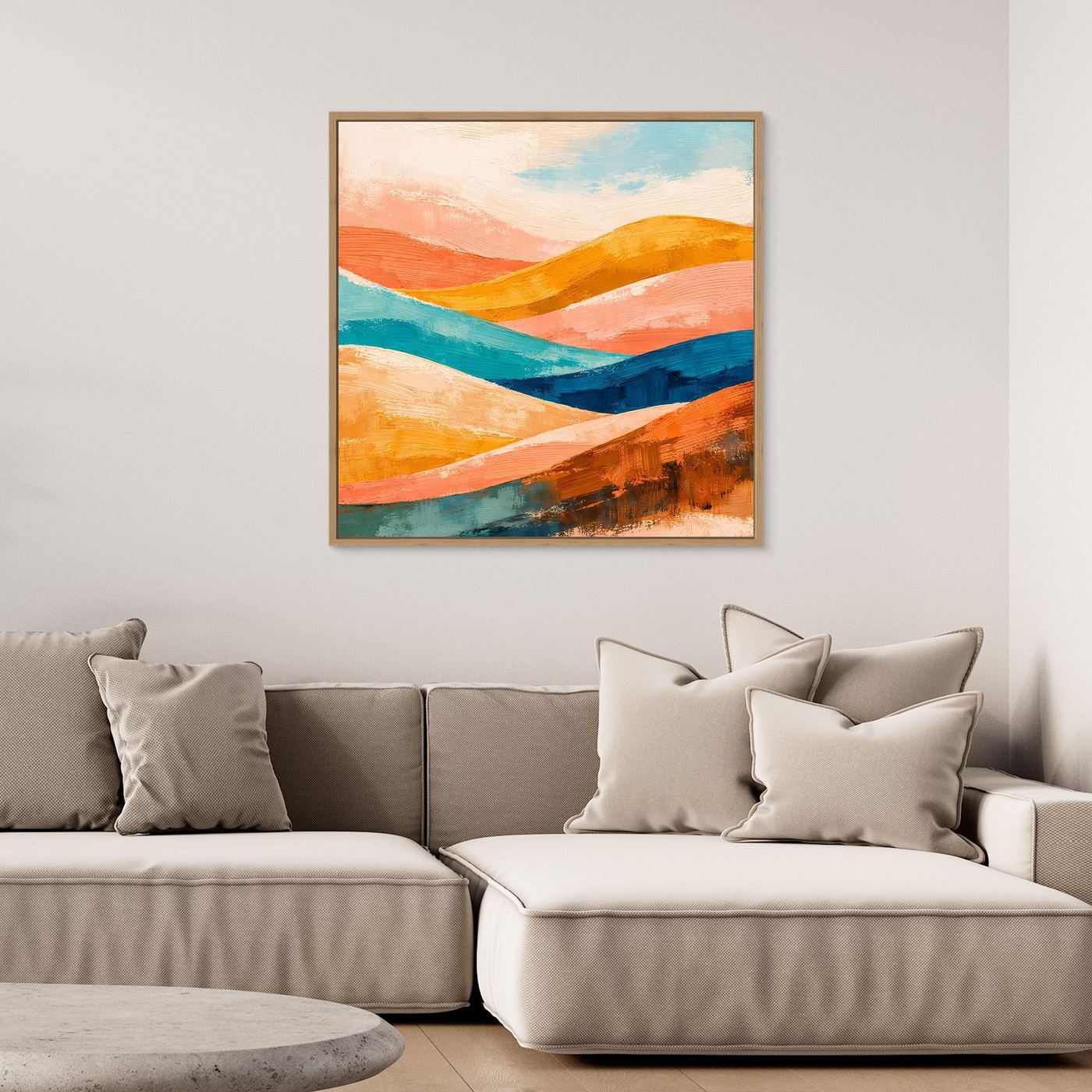 Black-framed canvas wall art with abstract orange, teal, and blue rolling hills