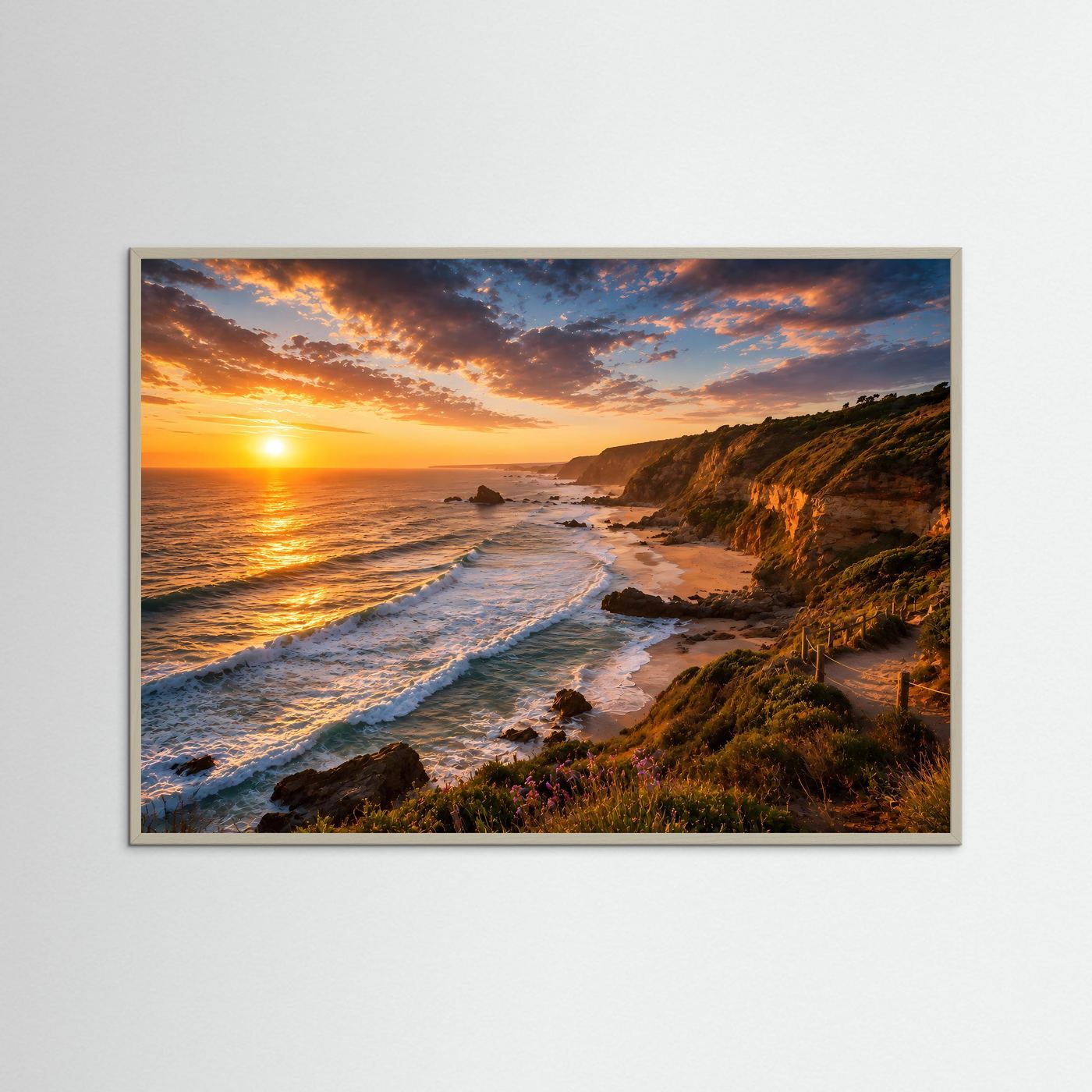 Poster im grauen Rahmen mit Küstenblick: Wellen, Klippen und orangefarbener Sonnenuntergang