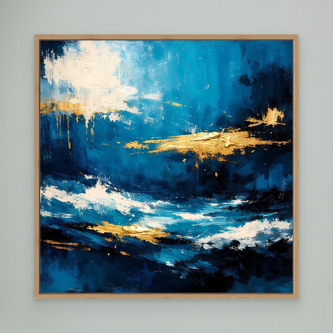 Leinwandbild mit abstrakten Meereswellen in Blau und Gold, weißer Schaum, Holzrahmen.
