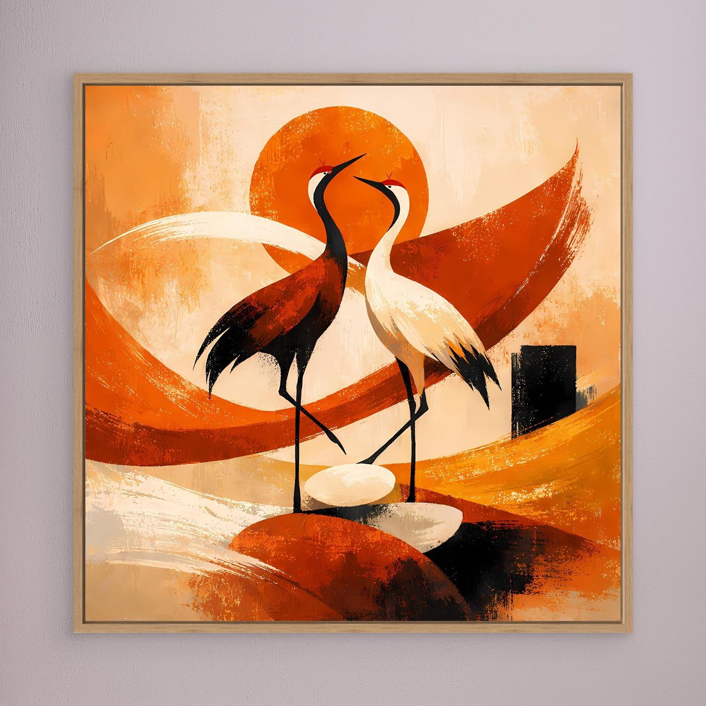Wandbild mit zwei Kranichen im Sonnenmotiv, orangefarbene Formen, goldbraun gerahmt.