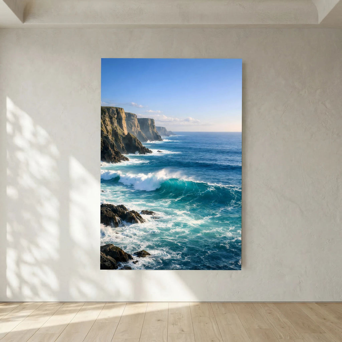 Hochformatiges Wandbild mit blauem Rand: Klippenküste, türkisblaues Wasser und Schaum