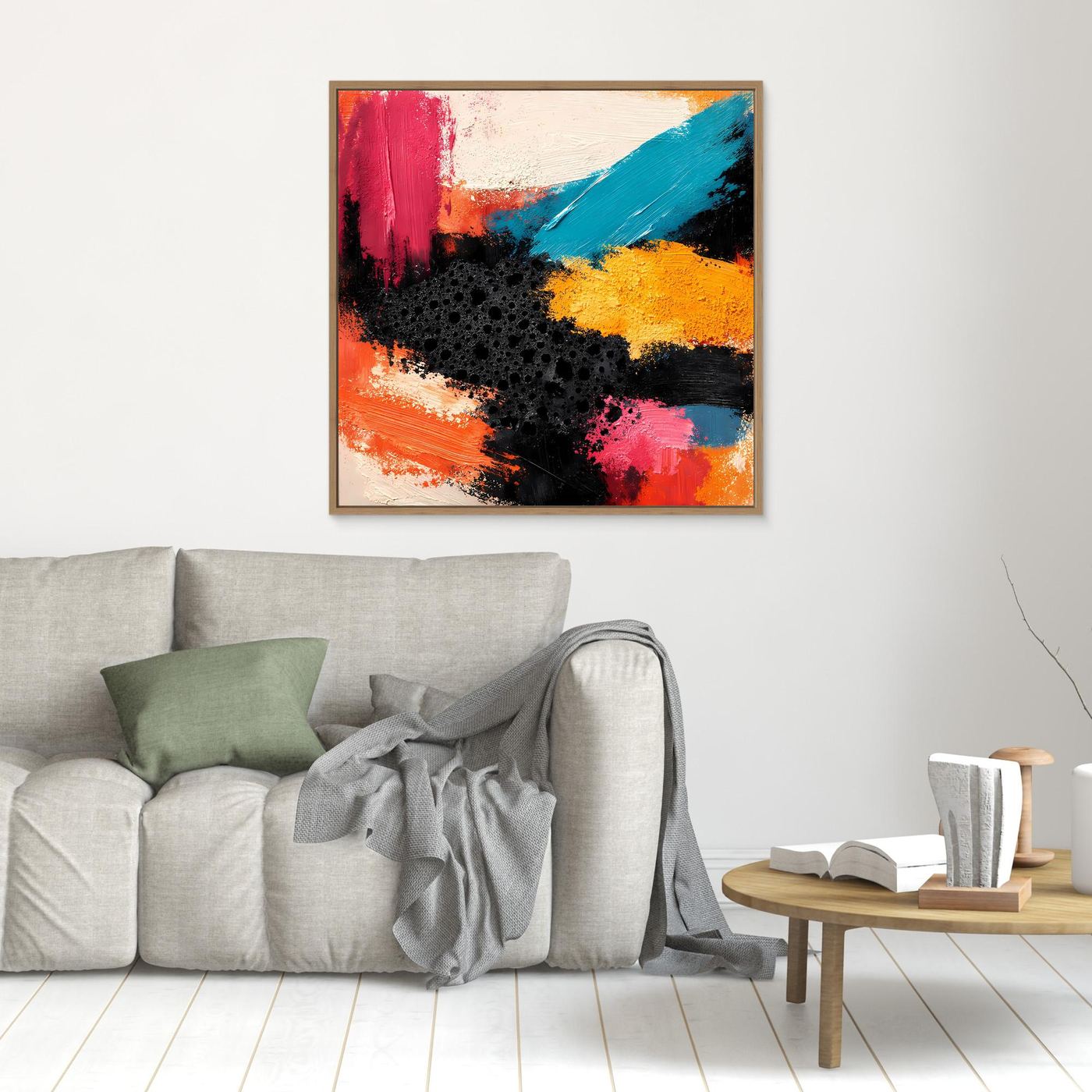 Kleines abstraktes Leinwandbild mit Farbflecken in Rot, Blau und Gelb, hell gerahmt