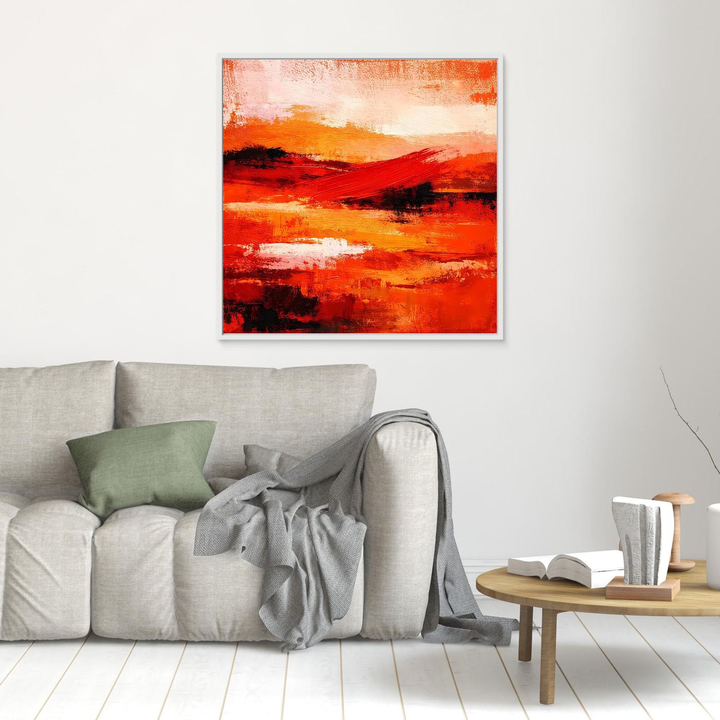 Quadratisches Wandbild aus Leinwand mit abstrakten Rot-Orange-Tönen und schwarzen Akzenten, mit hellem Rahmen