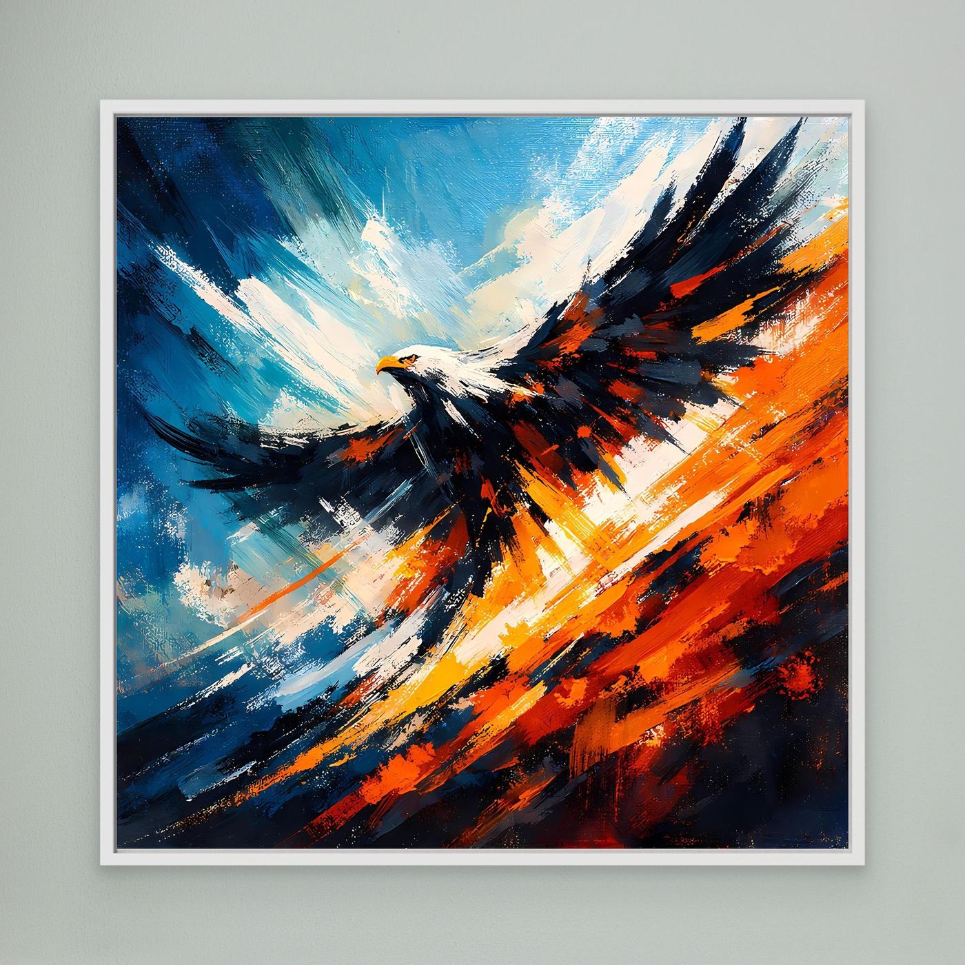 Wandbild mit abstraktem Adler in Blau, Orange und Schwarz, weiß gerahmt