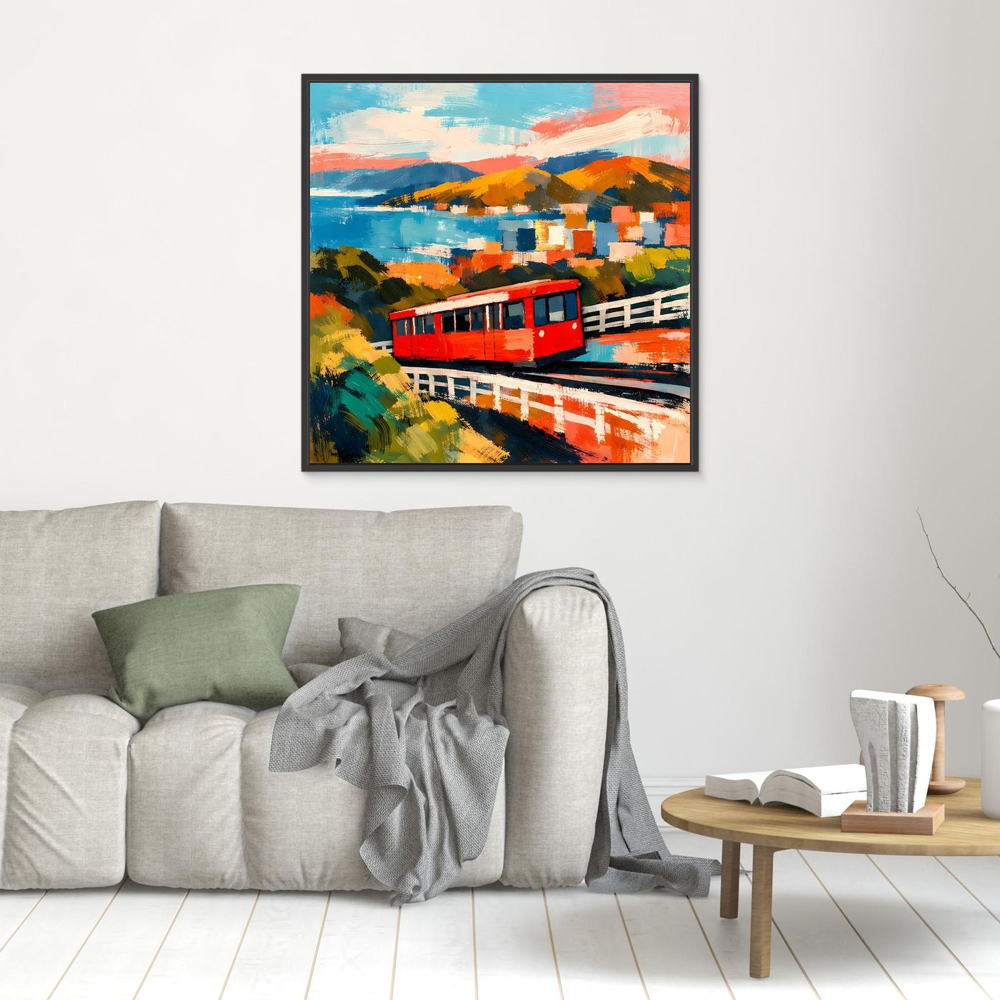 Kleines Wandbild mit roter Seilbahn, bunten Bergen und Meer im abstrakten Stil, schwarz gerahmt
