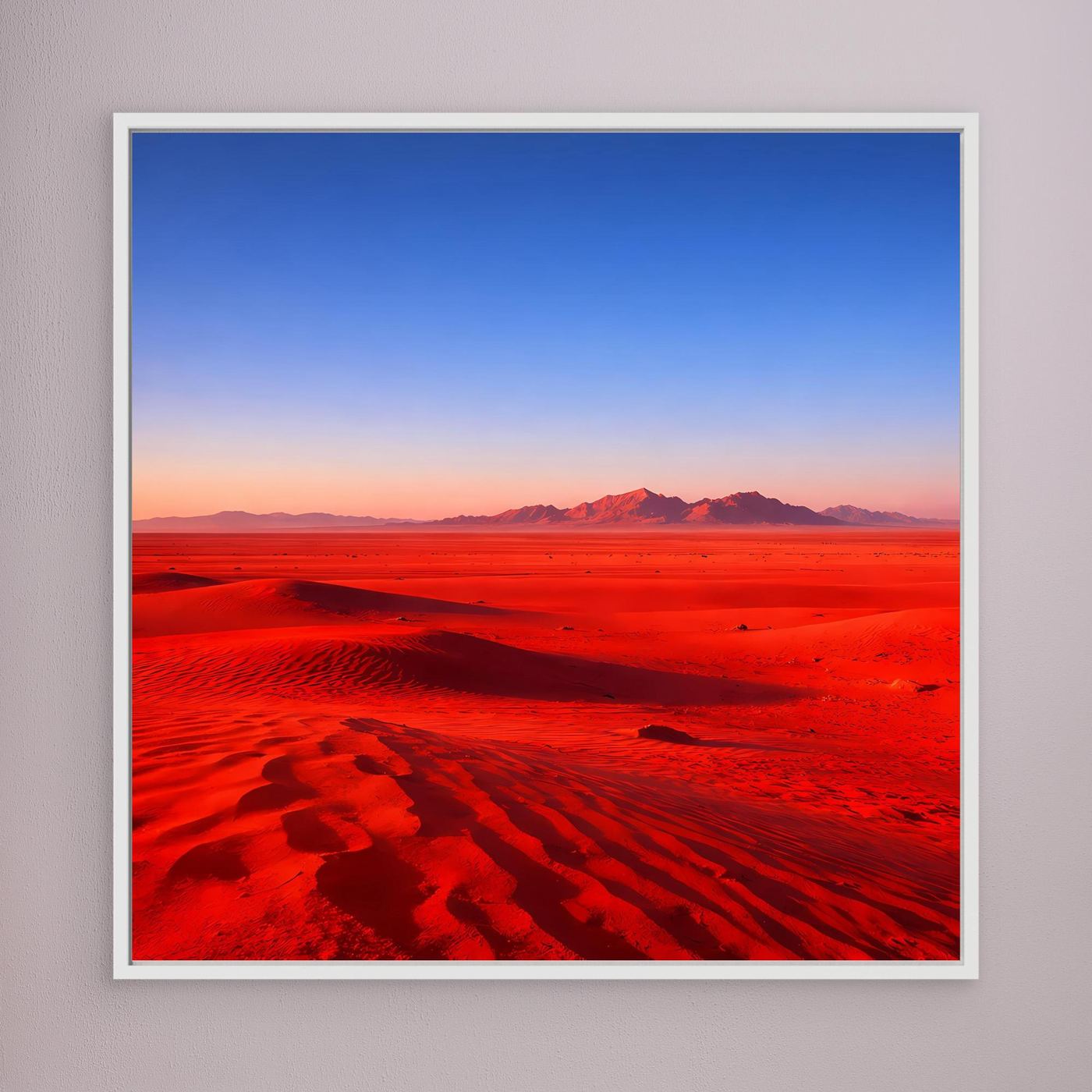 Leinwandbild mit weißem Rahmen, rote Dünenlandschaft mit blauem Himmel