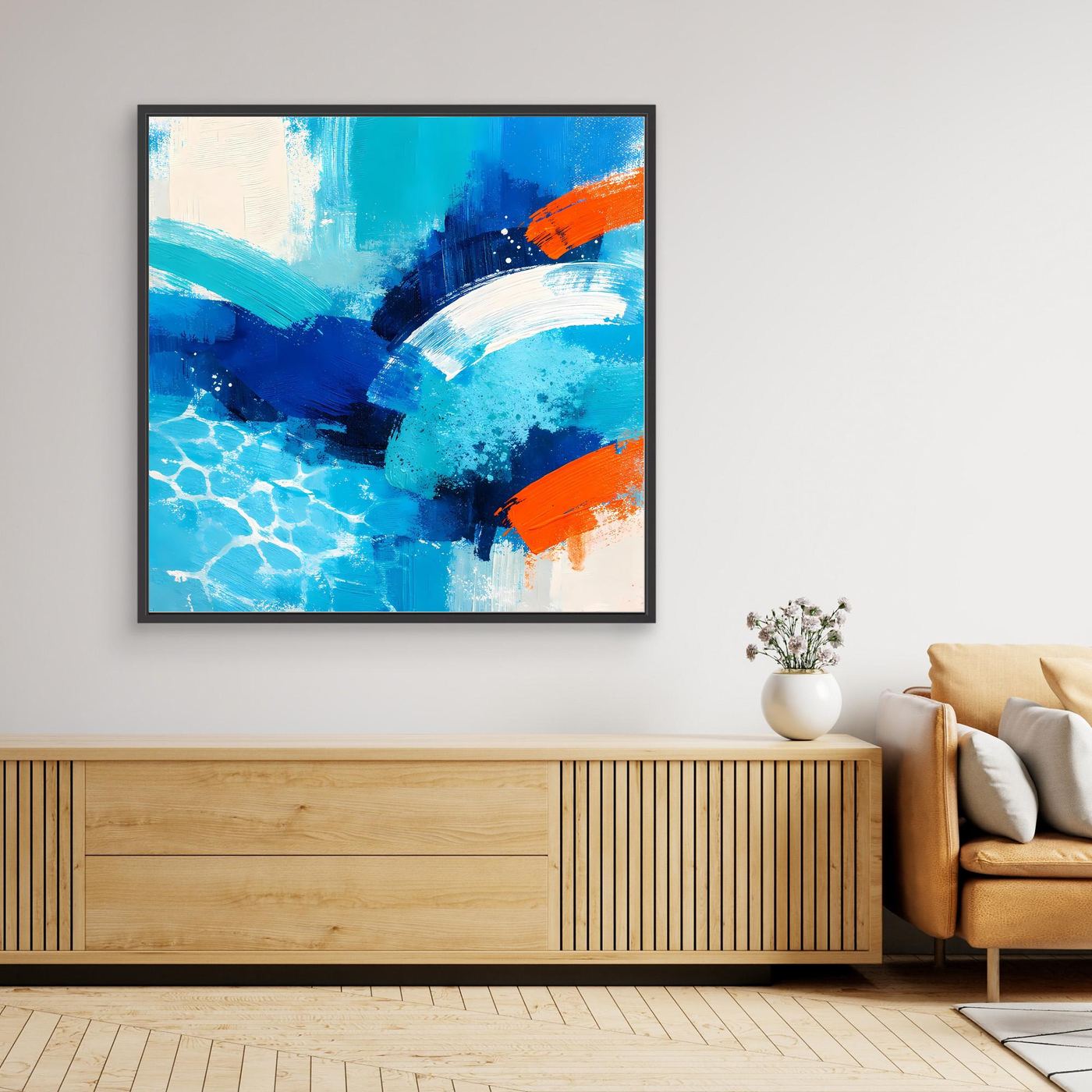 Framed canvas wall art with abstract blue ocean waves and orange strokes, black frame