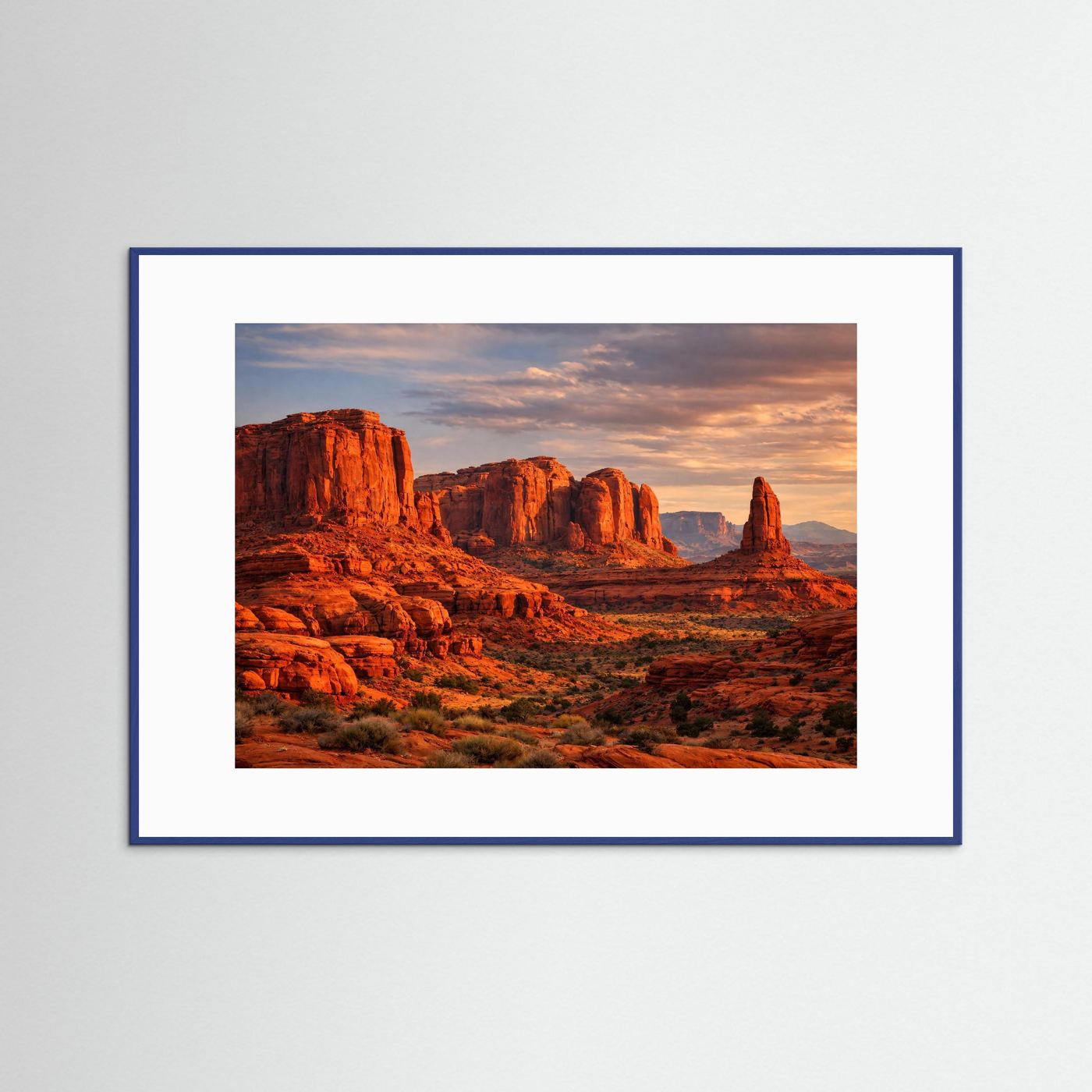 Wandbild mit Canyon-Landschaft im Abendlicht, blauer Rahmen