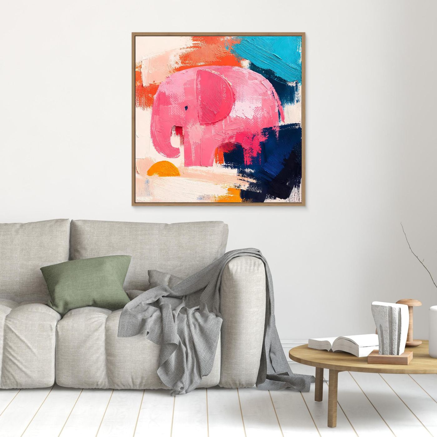 Gold-framed abstract elephant canvas painting with pink, blue, and orange brushstrokes