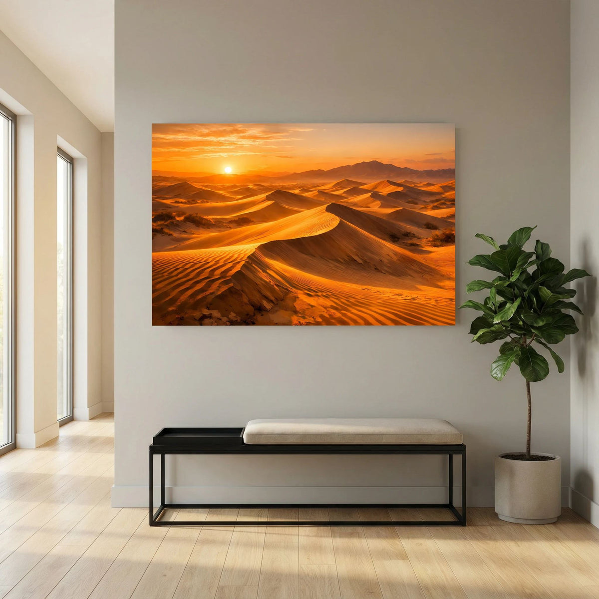 Wandbild mit Sanddünen im Abendsonnenlicht über Bank und Pflanze im Flur