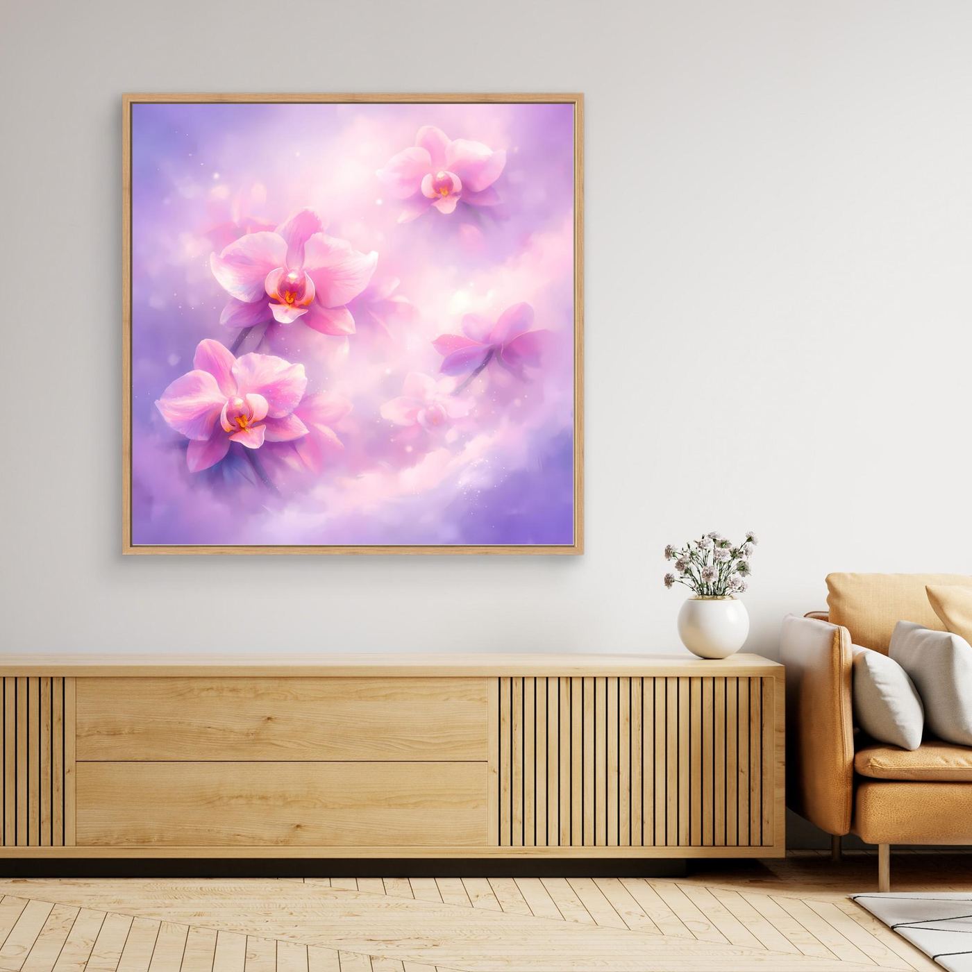 Leinwandbild mit pastellfarbenen Orchideen, lila-pinkes Motiv, mit goldfarbenem Rahmen.