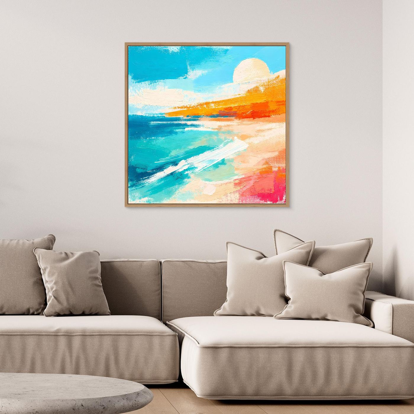 Abstract beach wall art in a light wood frame, teal ocean and orange sand colors.