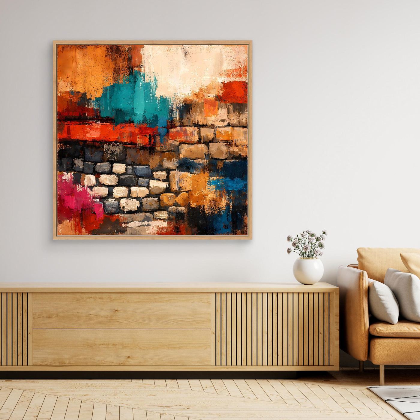 Gerahmtes Leinwandbild in Nahansicht mit Steinmauer-Optik, farbige Flächen in Orange, Teal, Rot, Blau.